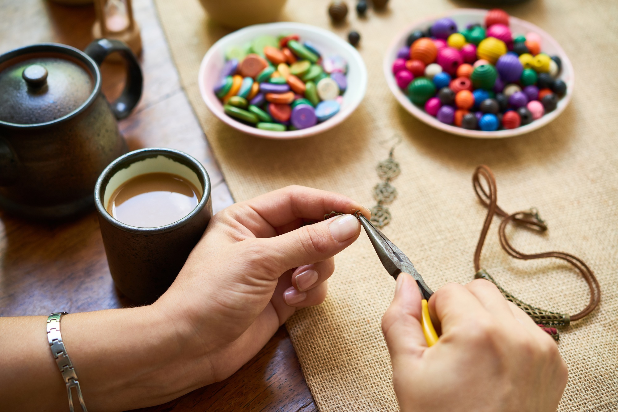 woman making handmade accessories